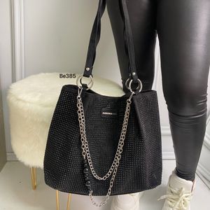 bolso negro apliques brillantes